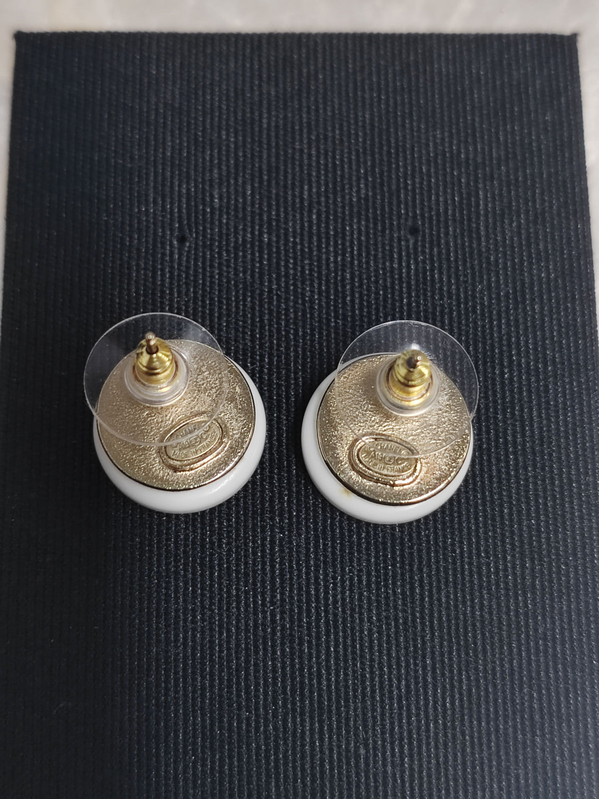 Chanel - Other - Metal with white resin and rhinestone accents; exact metal composition unspecified. - White