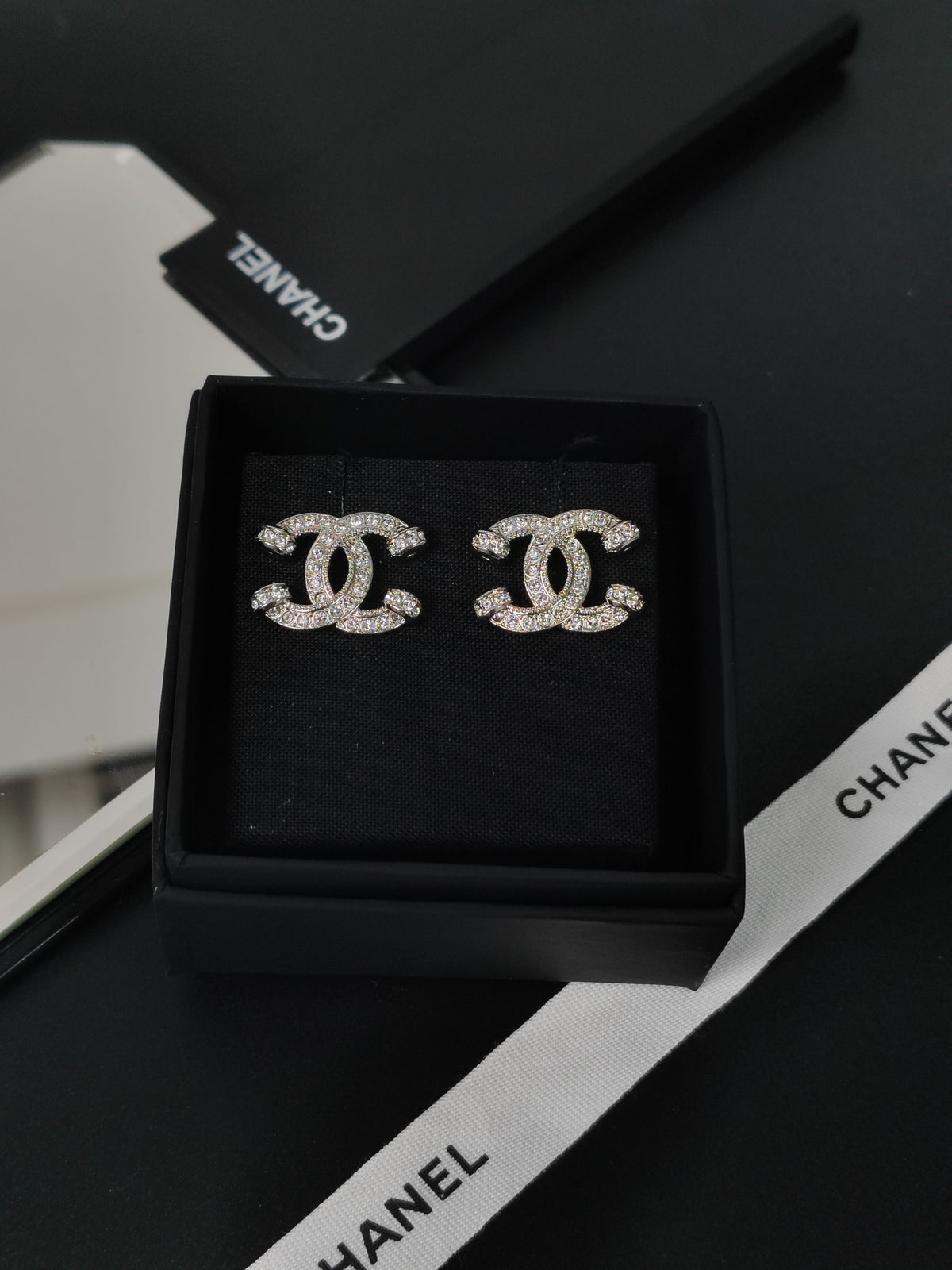 Chanel - Other - Silver-tone base metal with clear glass crystal embellishments. - Silver