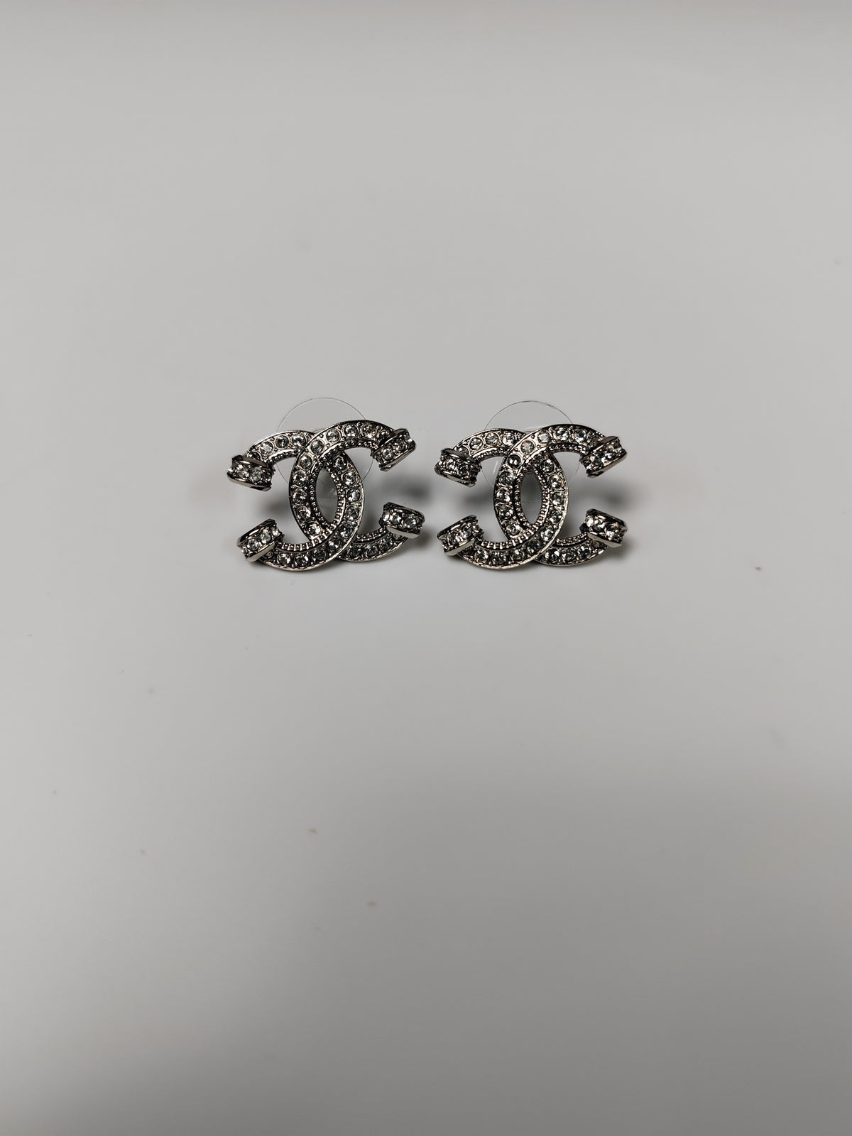 Chanel - Other - Silver-tone base metal with clear glass crystal embellishments. - Silver