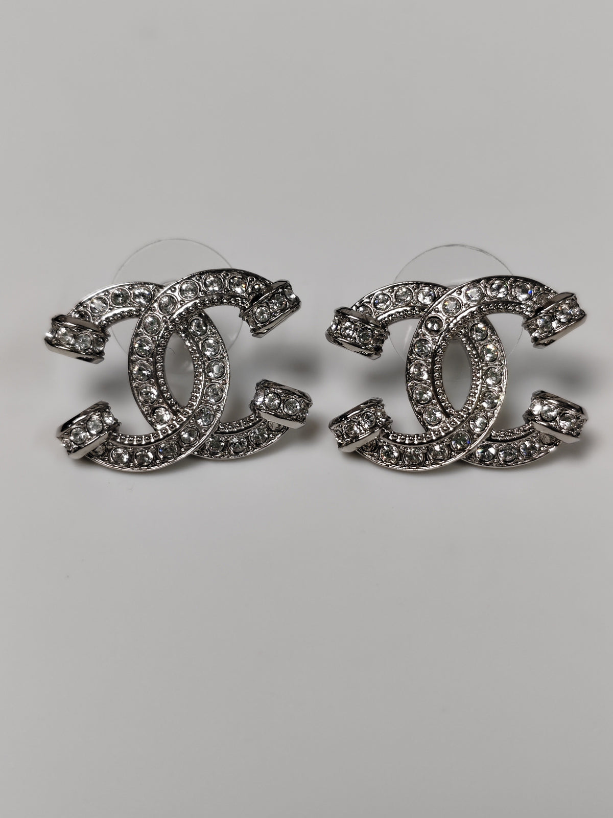Chanel - Other - Silver-tone base metal with clear glass crystal embellishments. - Silver