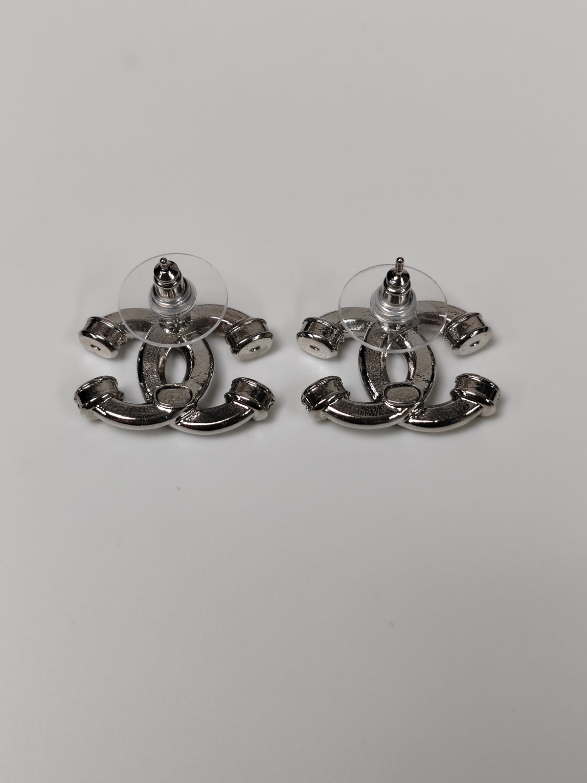 Chanel - Other - Silver-tone base metal with clear glass crystal embellishments. - Silver