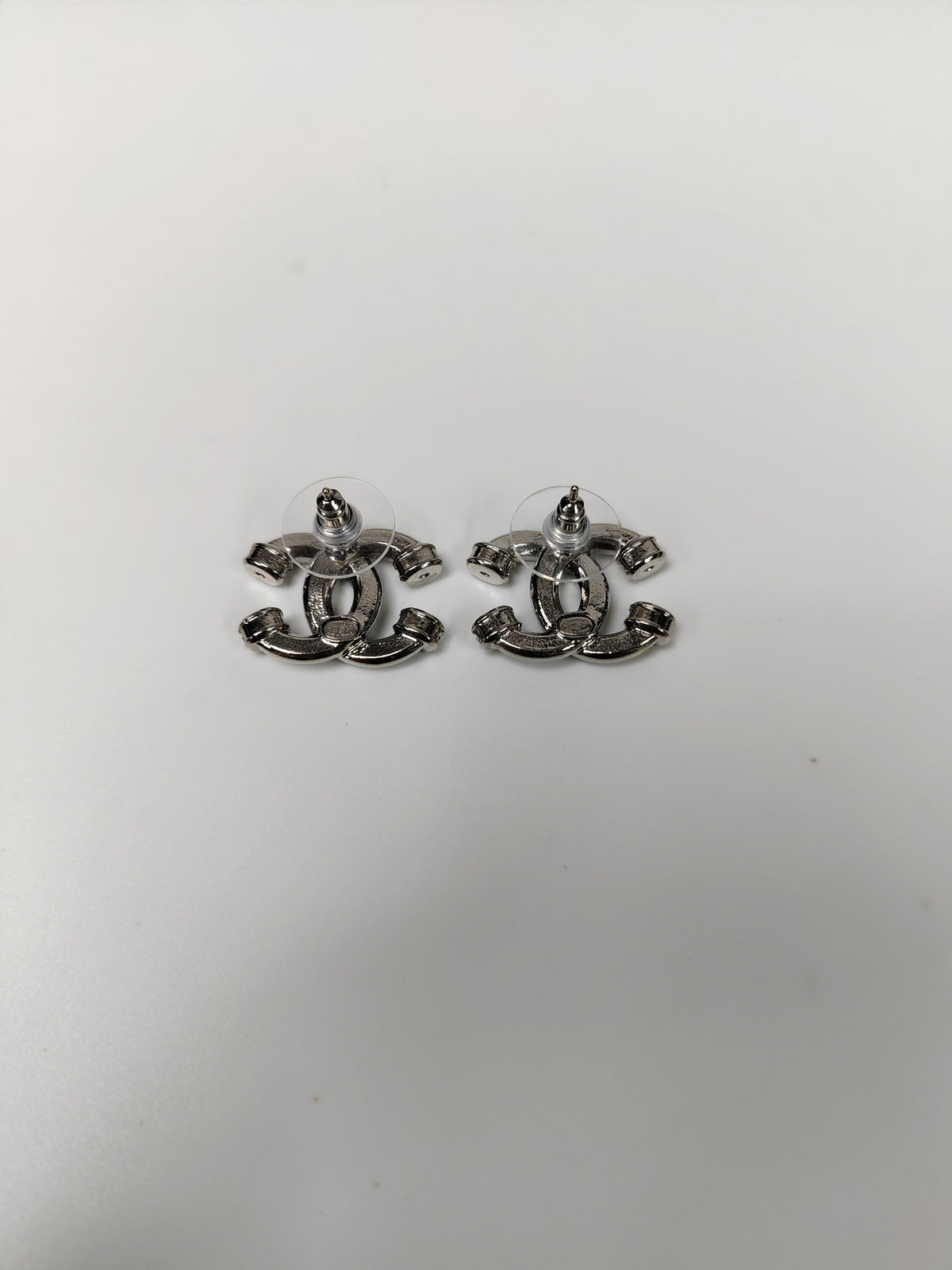 Chanel - Other - Silver-tone base metal with clear glass crystal embellishments. - Silver