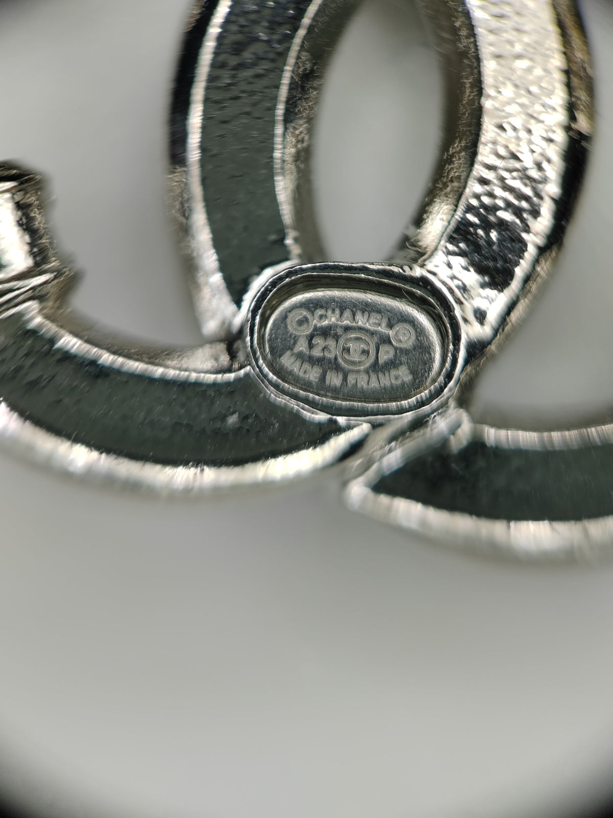 Chanel - Other - Silver-tone base metal with clear glass crystal embellishments. - Silver