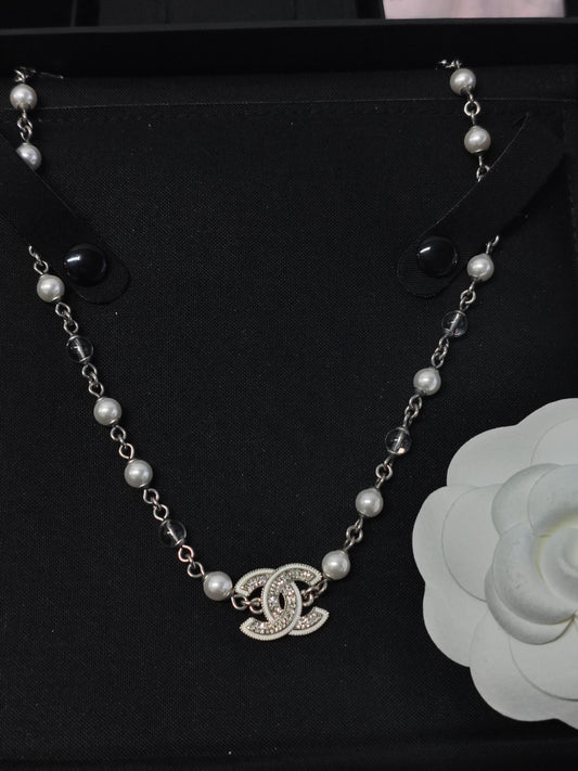 Chanel - Other - Silver-tone base metal with imitation pearls and clear rhinestones. - Silver