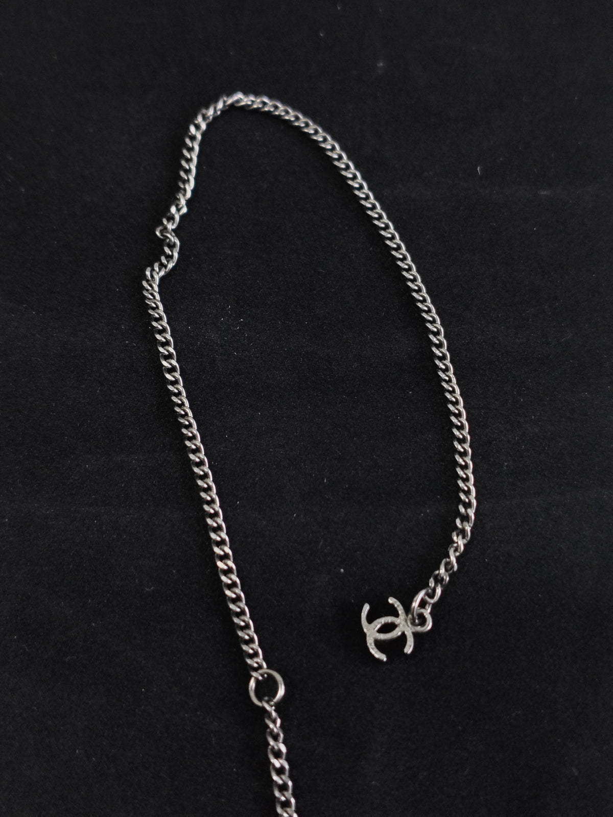 Chanel - Other - Silver-tone base metal with pearl-like and dark decorative accents; exact composition is not confirmed. - Silver