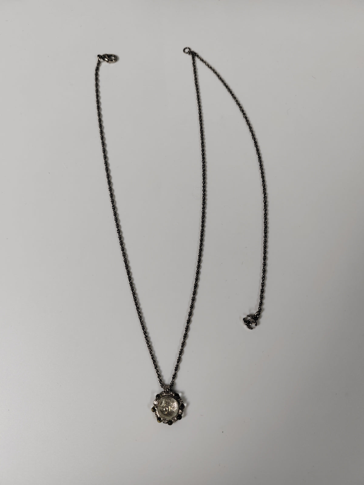 Chanel - Other - Silver-tone metal alloy with clear rhinestone accents and dark round decorative beads. - Silver