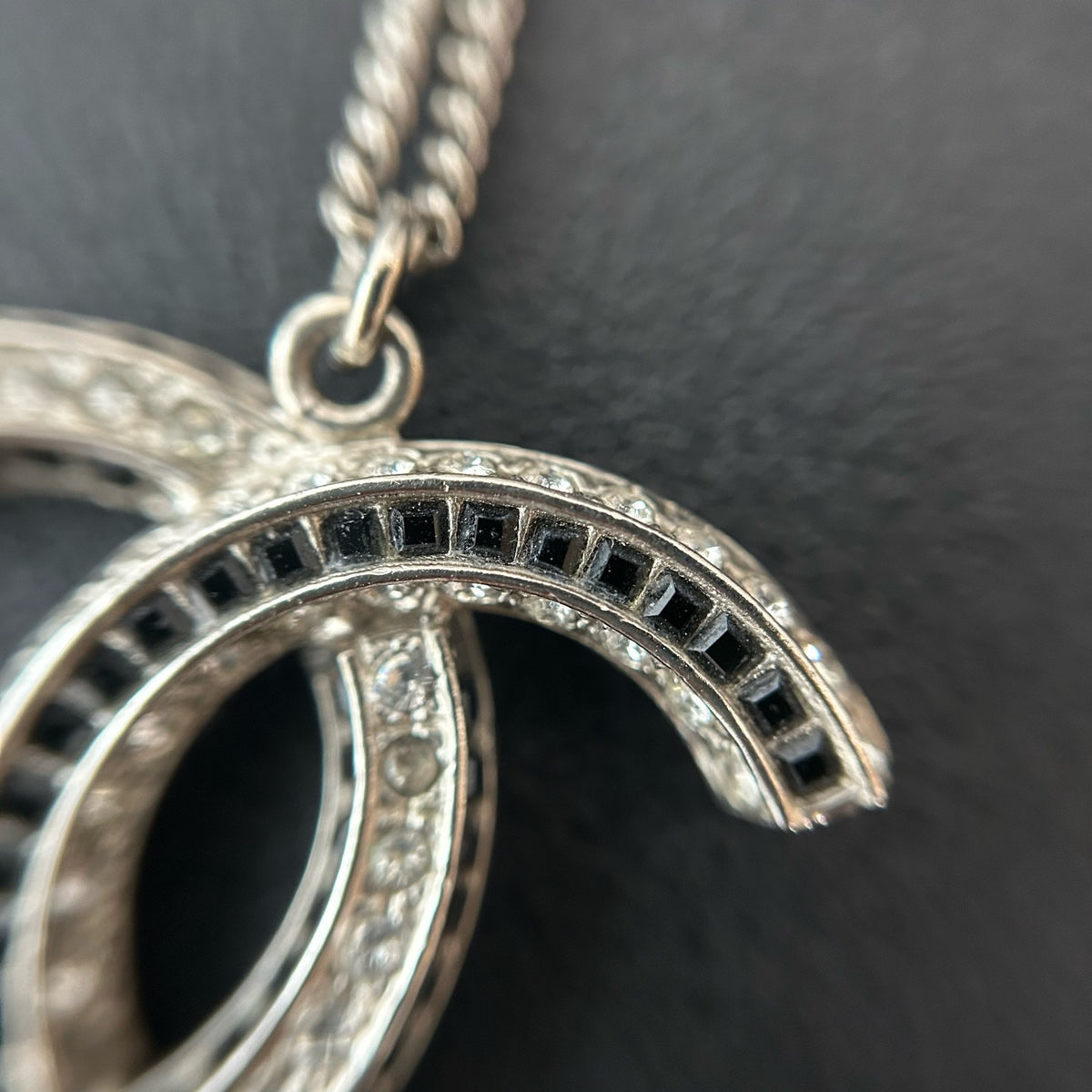 Chanel - Other - Silver-tone metal with clear and black glass-like embellishments; exact stone composition is unconfirmed. - Silver