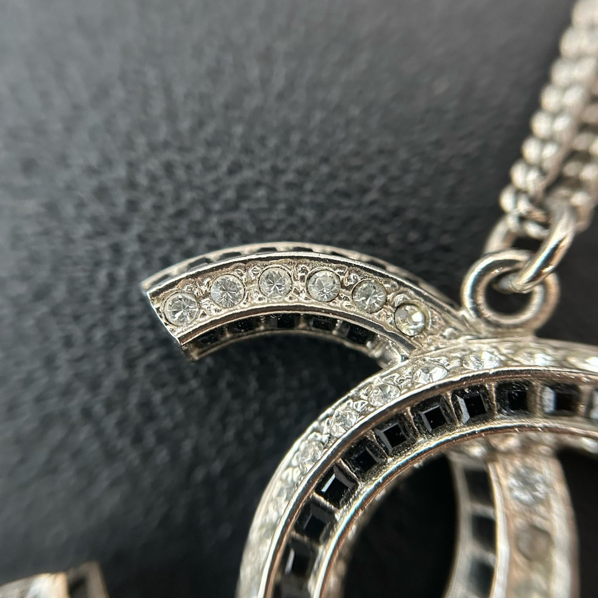Chanel - Other - Silver-tone metal with clear and black glass-like embellishments; exact stone composition is unconfirmed. - Silver
