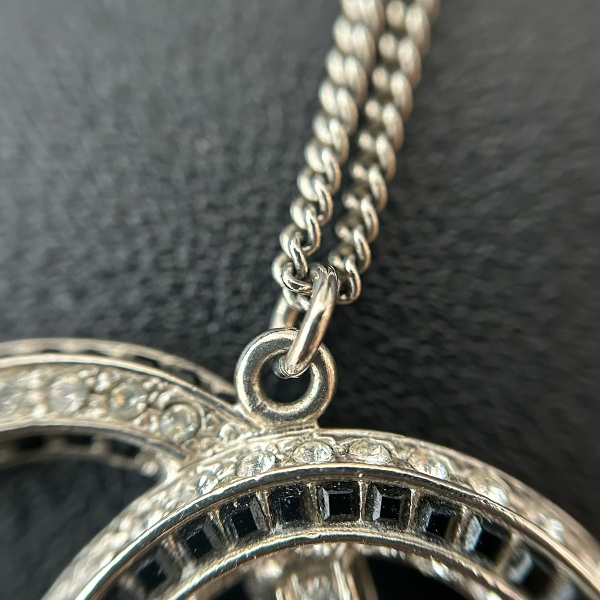 Chanel - Other - Silver-tone metal with clear and black glass-like embellishments; exact stone composition is unconfirmed. - Silver