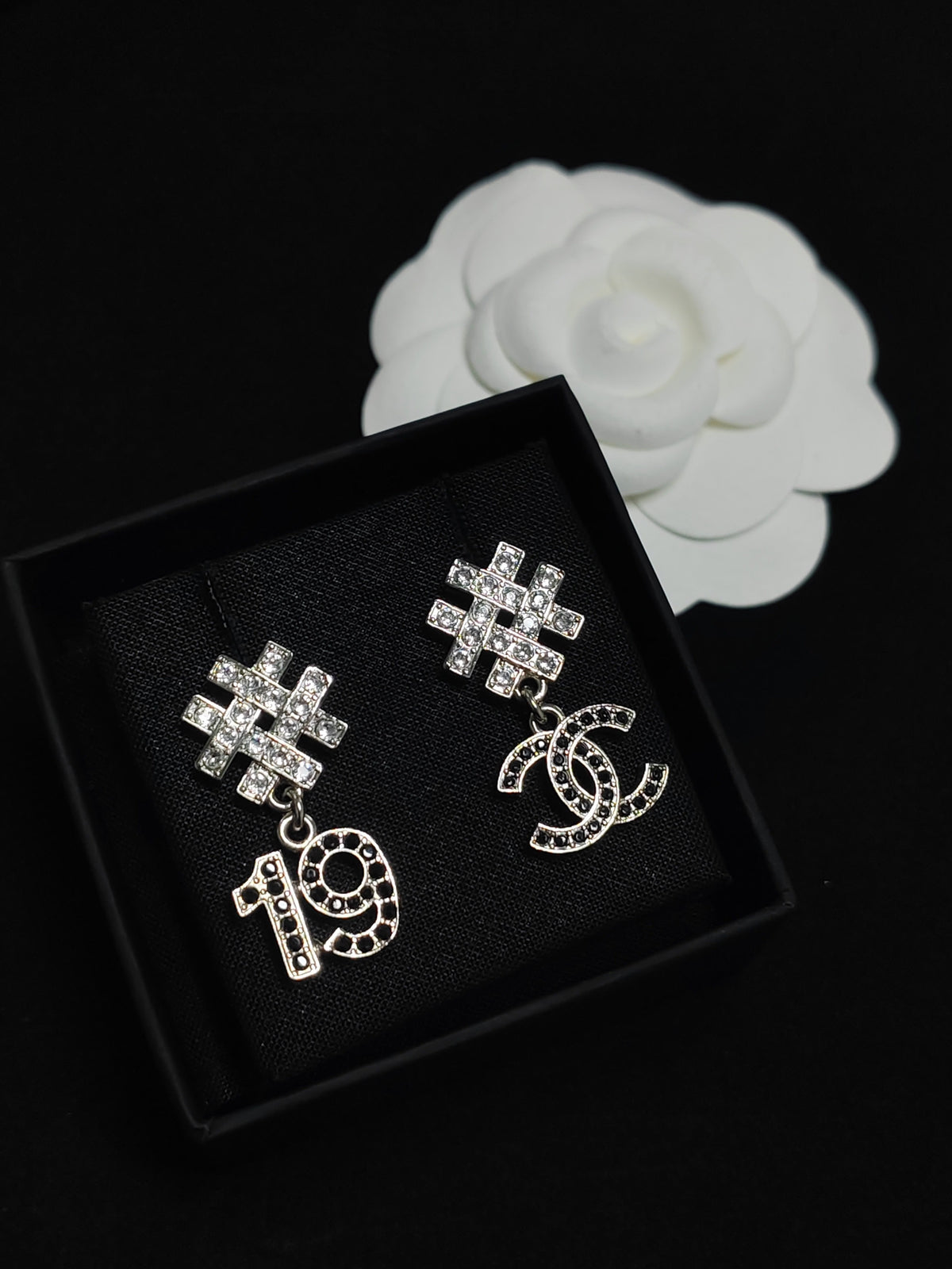 Chanel - Other - Silver-tone metal with clear and black rhinestone accents. - Multicolour
