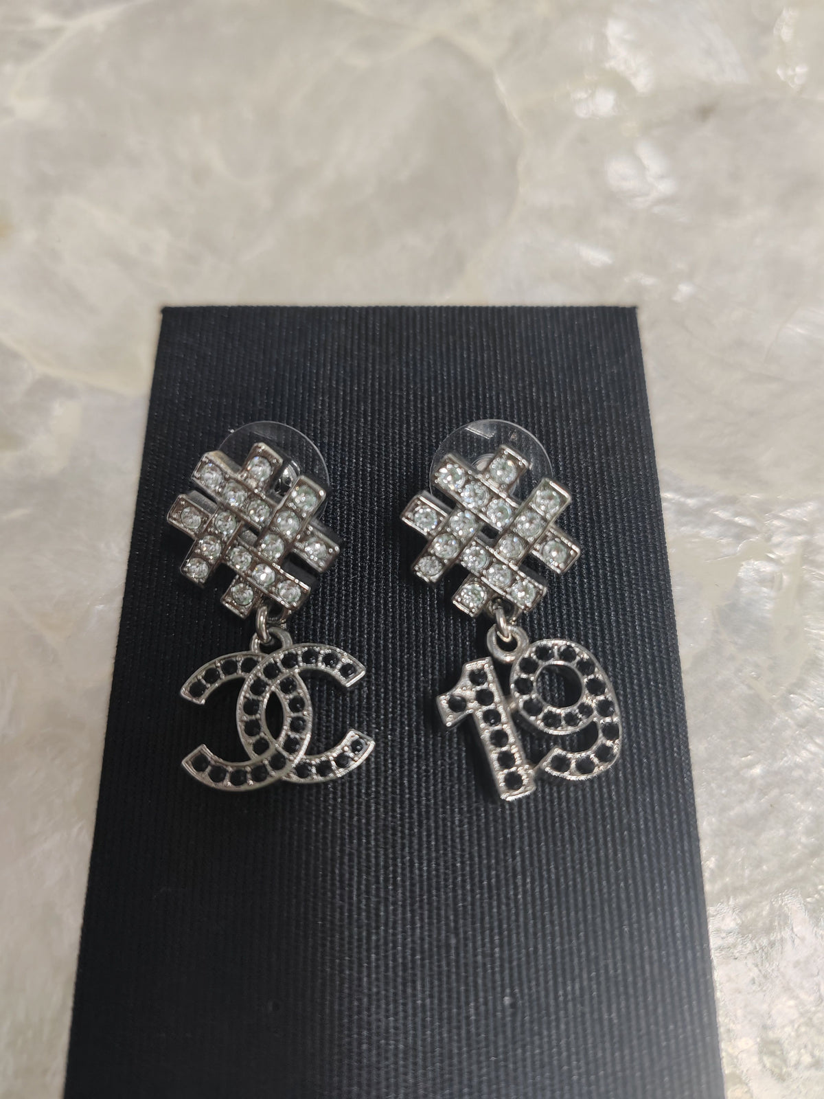 Chanel - Other - Silver-tone metal with clear and black rhinestone accents. - Multicolour