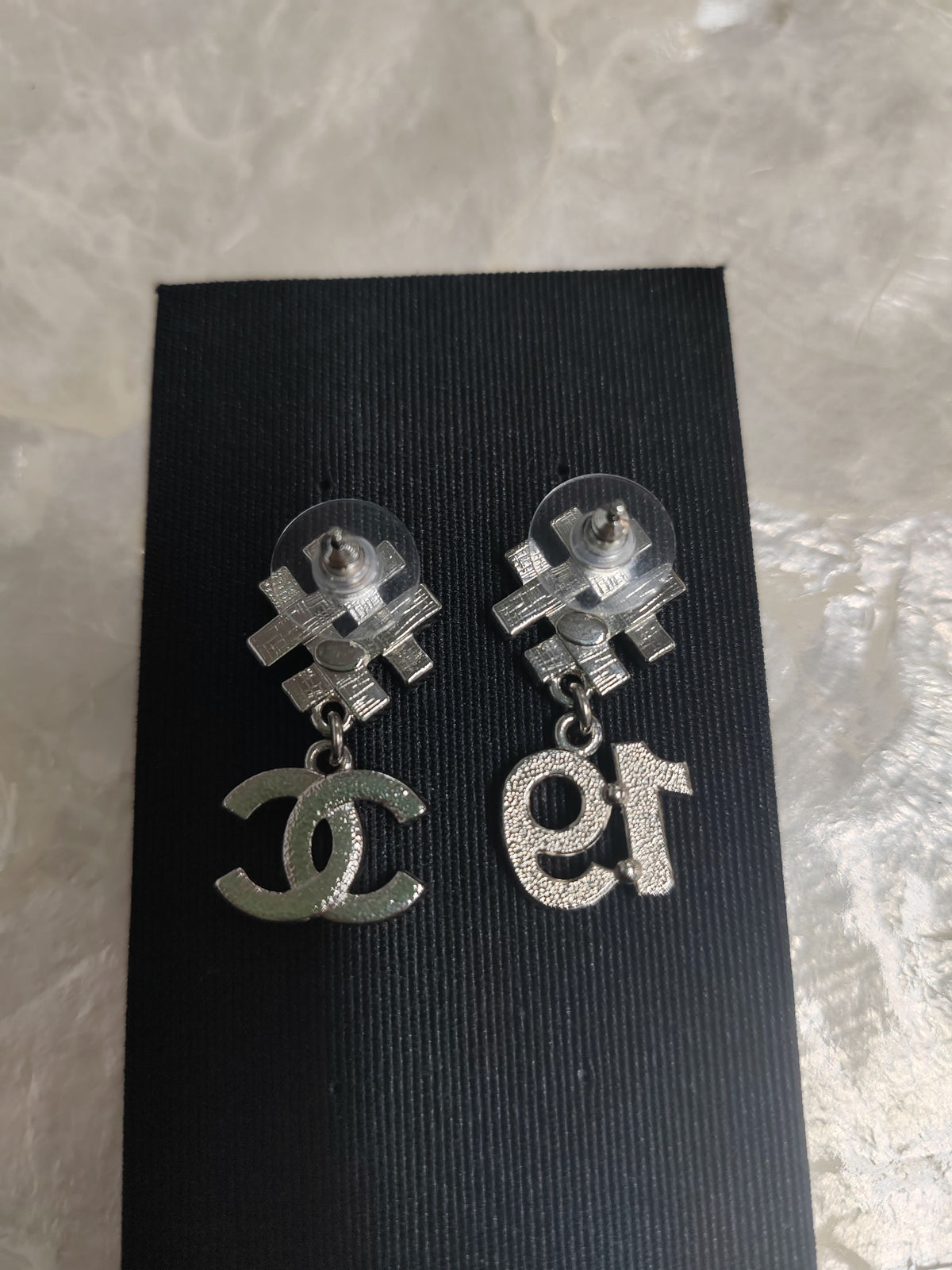 Chanel - Other - Silver-tone metal with clear and black rhinestone accents. - Multicolour