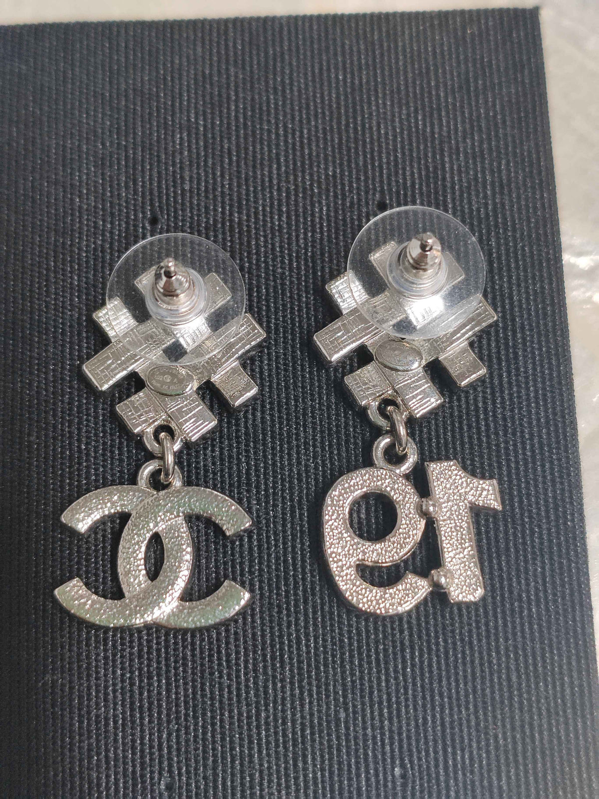 Chanel - Other - Silver-tone metal with clear and black rhinestone accents. - Multicolour