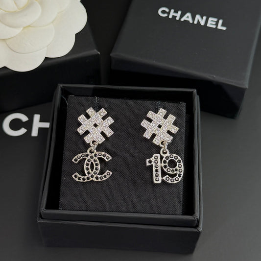 Chanel - Other - Silver-tone metal with clear and black rhinestone embellishments. - Silver