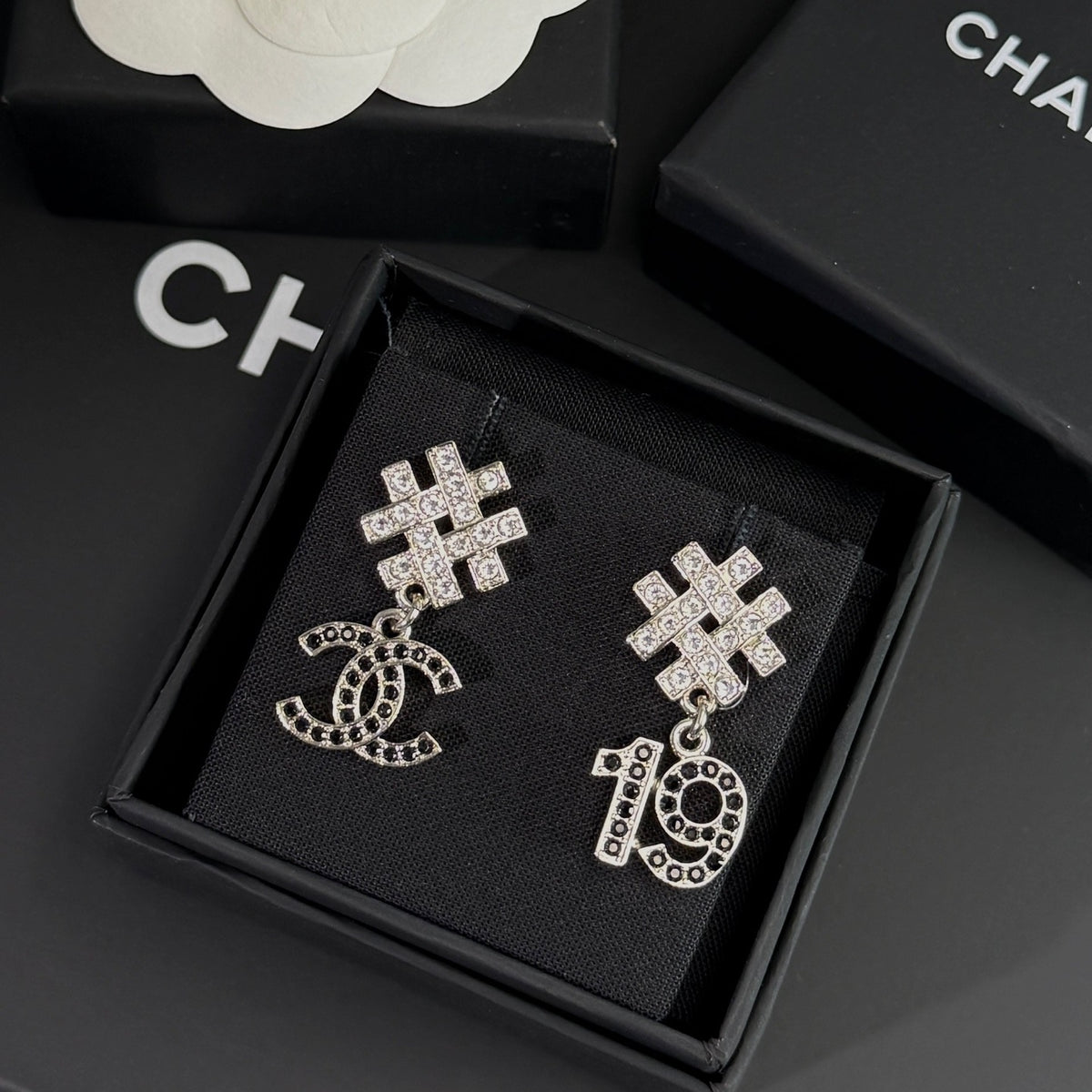 Chanel - Other - Silver-tone metal with clear and black rhinestone embellishments. - Silver