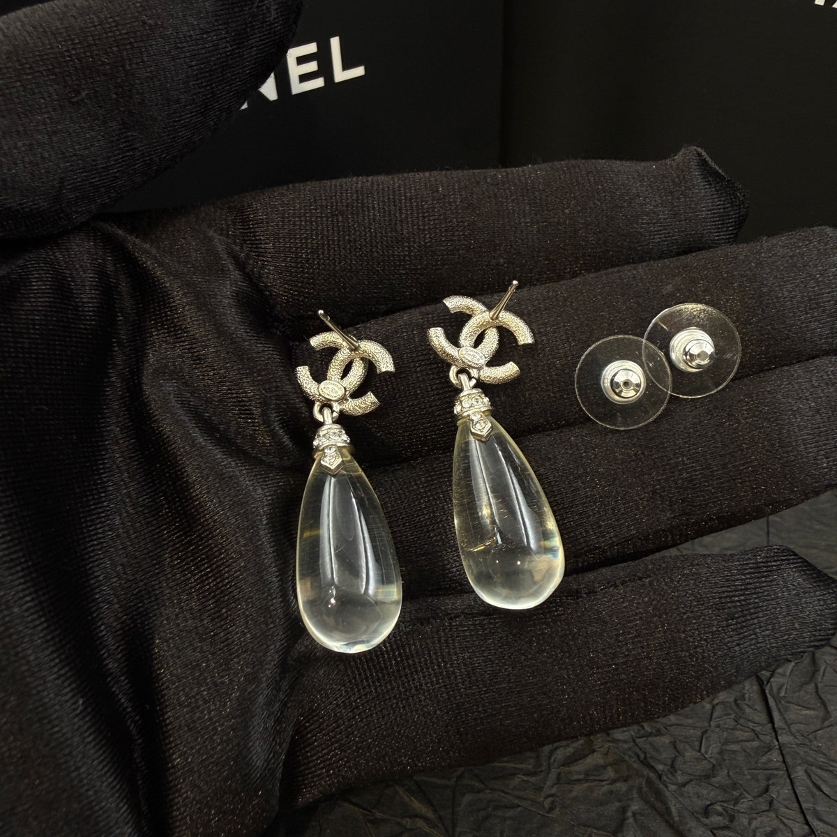 Chanel - Other - Silver-tone metal with clear crystal embellishments. - Silver