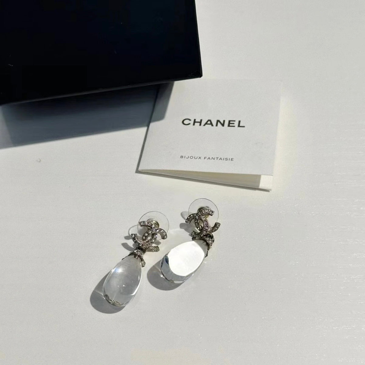 Chanel - Other - Silver-tone metal with clear crystal embellishments. - Silver
