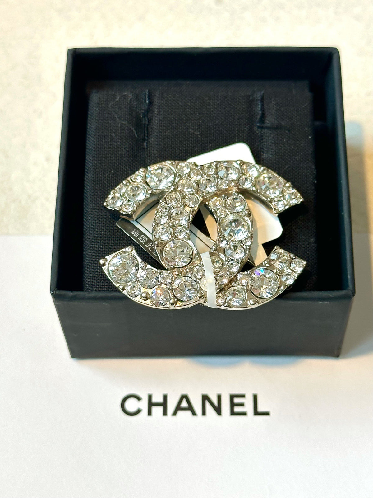 Chanel - Other - Silver-tone metal with clear glass crystals. - Silver