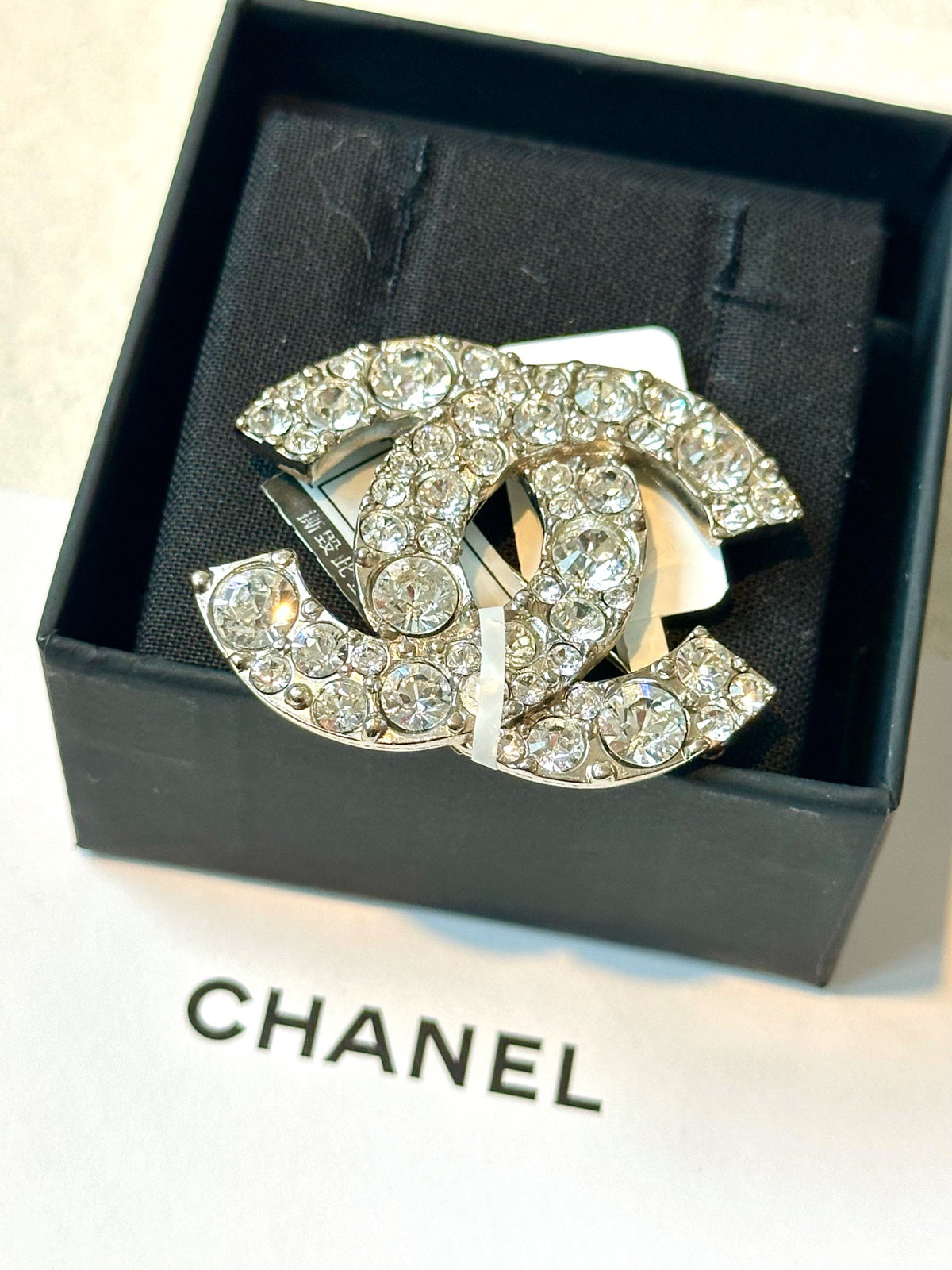 Chanel - Other - Silver-tone metal with clear glass crystals. - Silver