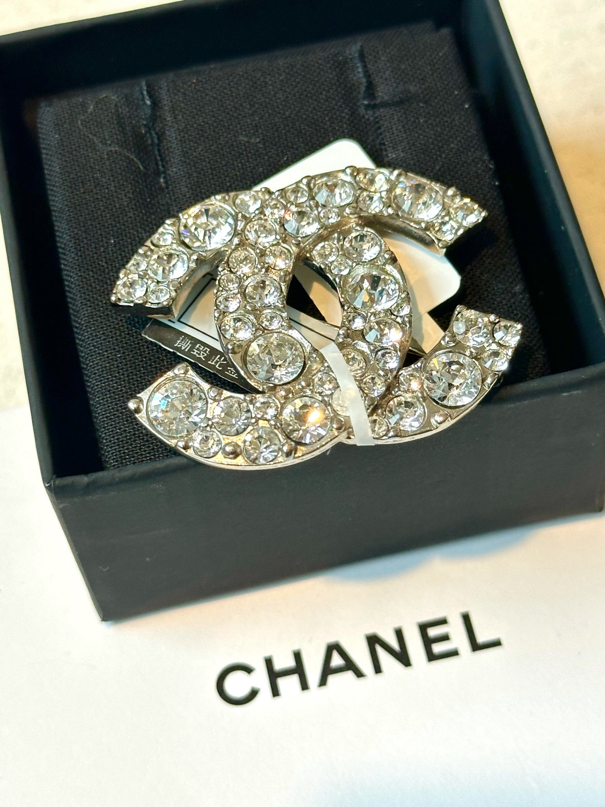 Chanel - Other - Silver-tone metal with clear glass crystals. - Silver