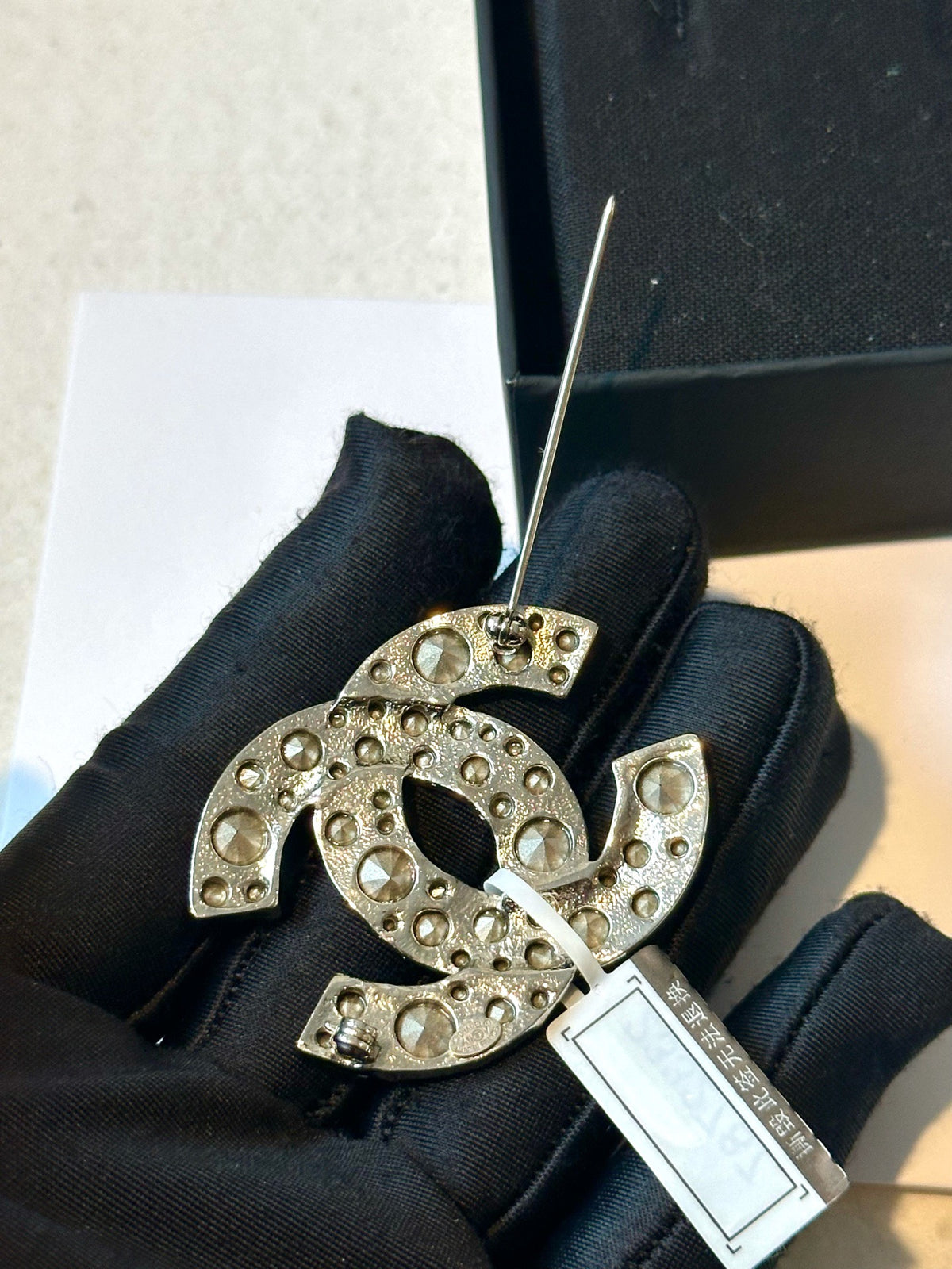 Chanel - Other - Silver-tone metal with clear glass crystals. - Silver