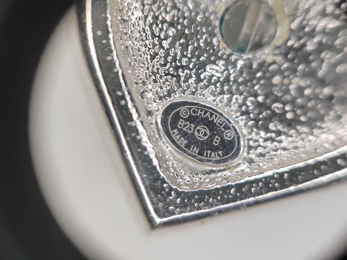 Chanel - Other - Silver-tone metal with clear rhinestone accents and a white heart-shaped inlay; exact composition unknown. - Silver