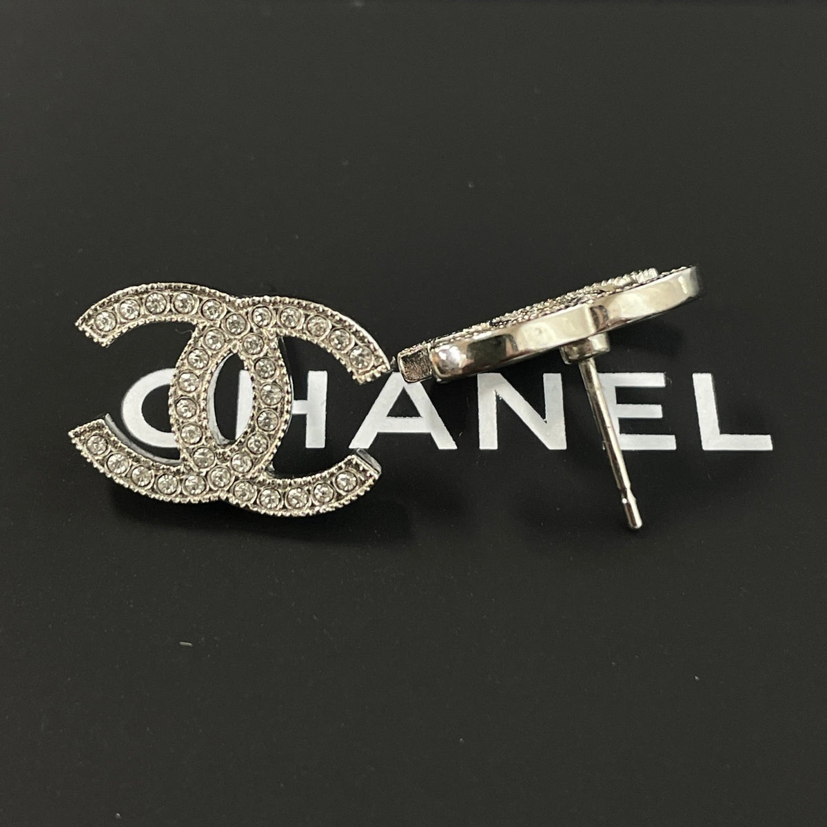 Chanel - Other - Silver-tone metal with clear rhinestone embellishments; exact alloy unspecified. - Silver