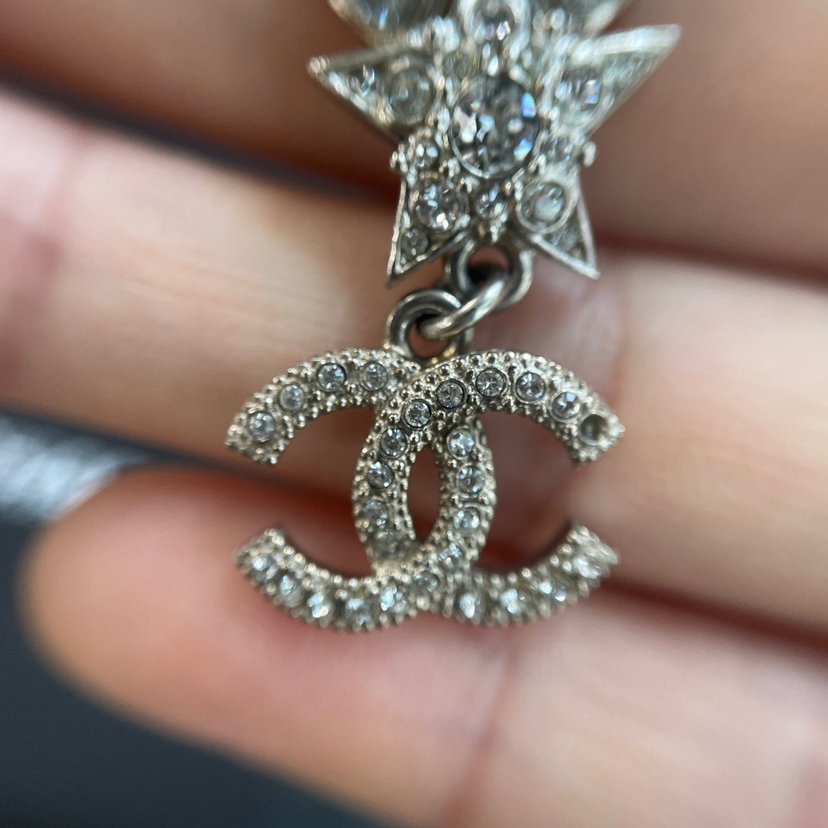 Chanel - Other - Silver-tone metal with clear rhinestone embellishments; exact composition is unconfirmed. - Silver