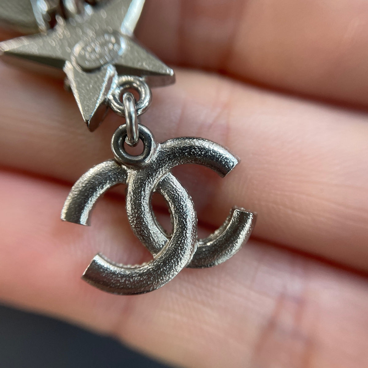 Chanel - Other - Silver-tone metal with clear rhinestone embellishments; exact composition is unconfirmed. - Silver