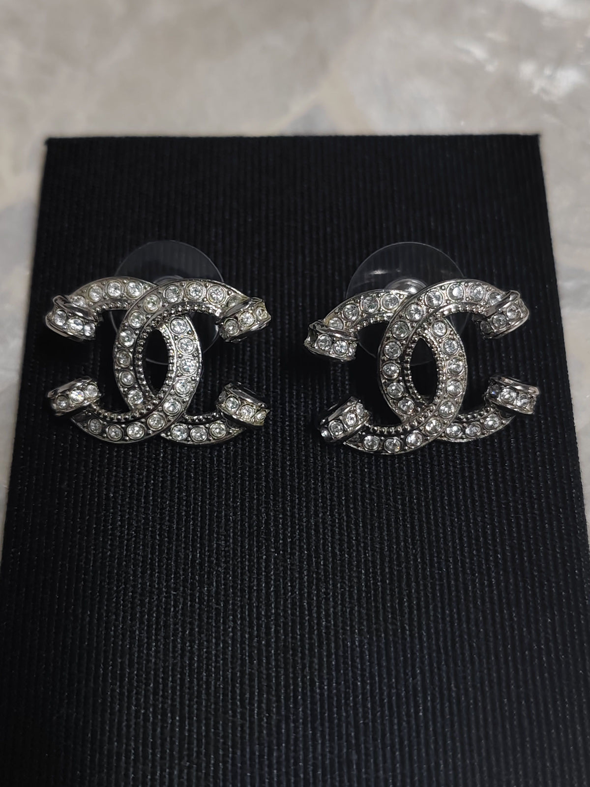 Chanel - Other - Silver-tone metal with clear rhinestone embellishments; exact metal composition is unspecified. - Silver