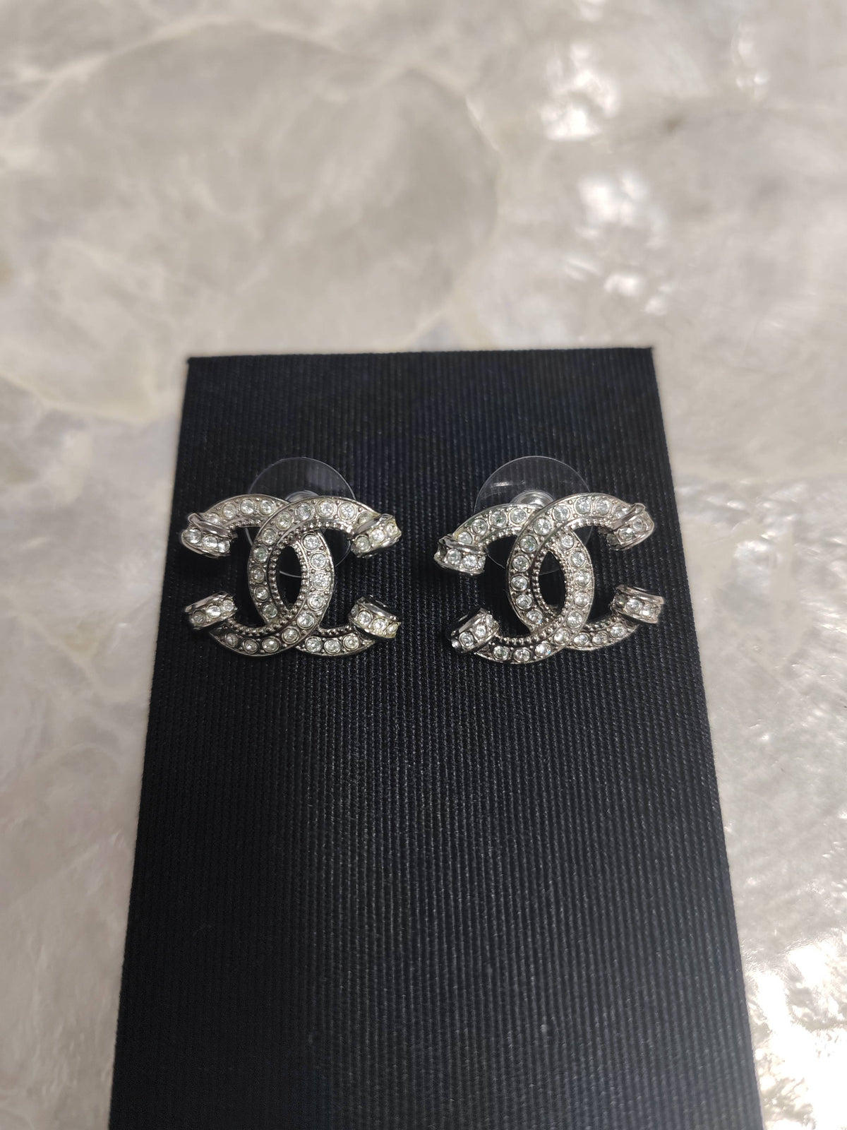 Chanel - Other - Silver-tone metal with clear rhinestone embellishments; exact metal composition is unspecified. - Silver