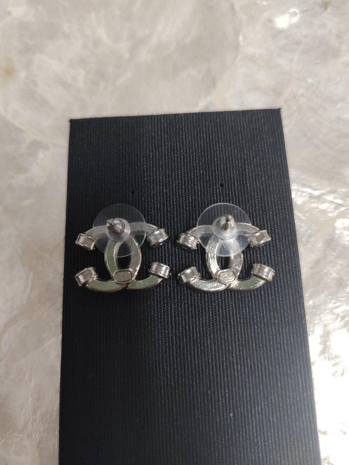 Chanel - Other - Silver-tone metal with clear rhinestone embellishments; exact metal composition is unspecified. - Silver