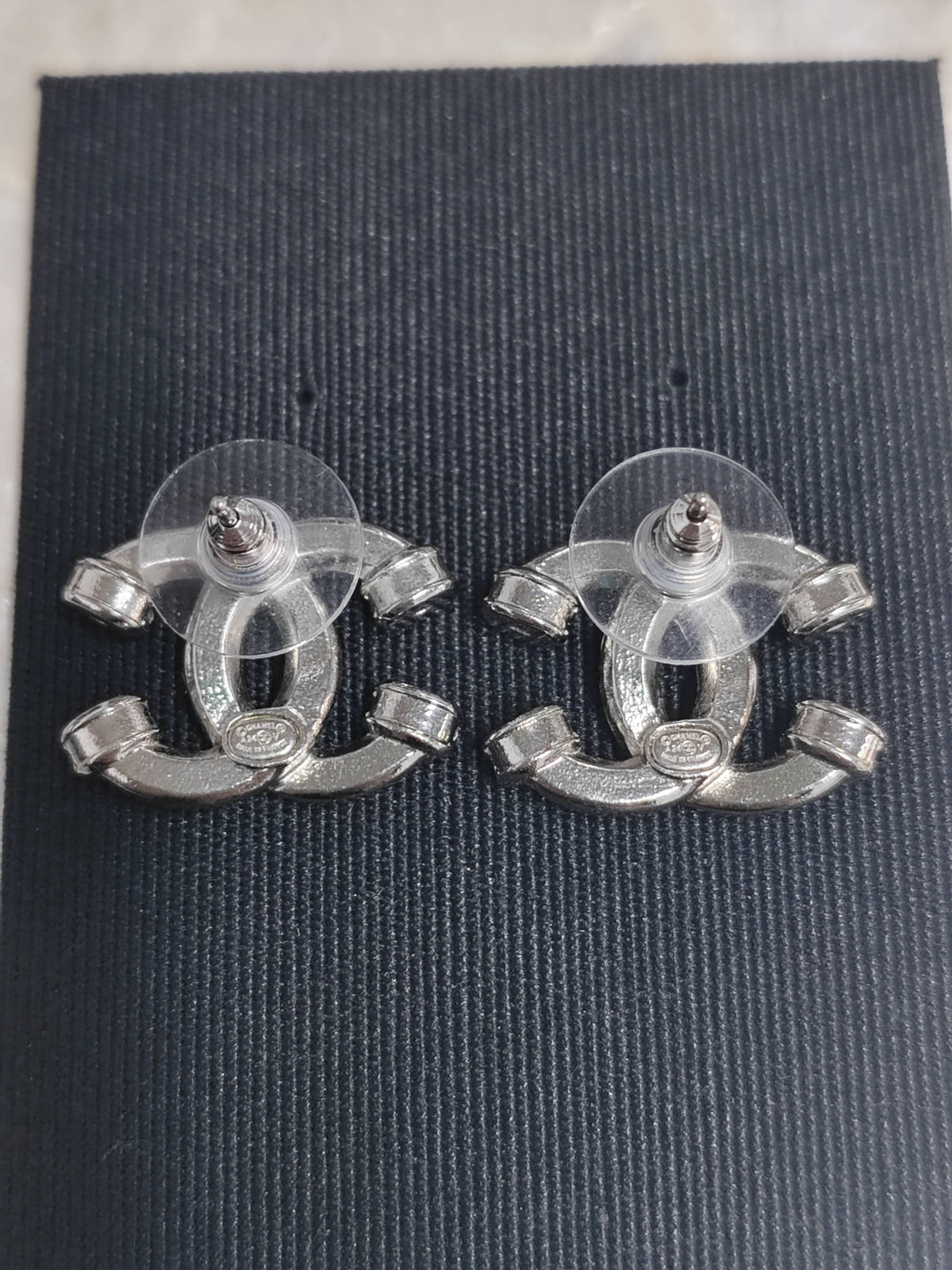 Chanel - Other - Silver-tone metal with clear rhinestone embellishments; exact metal composition is unspecified. - Silver