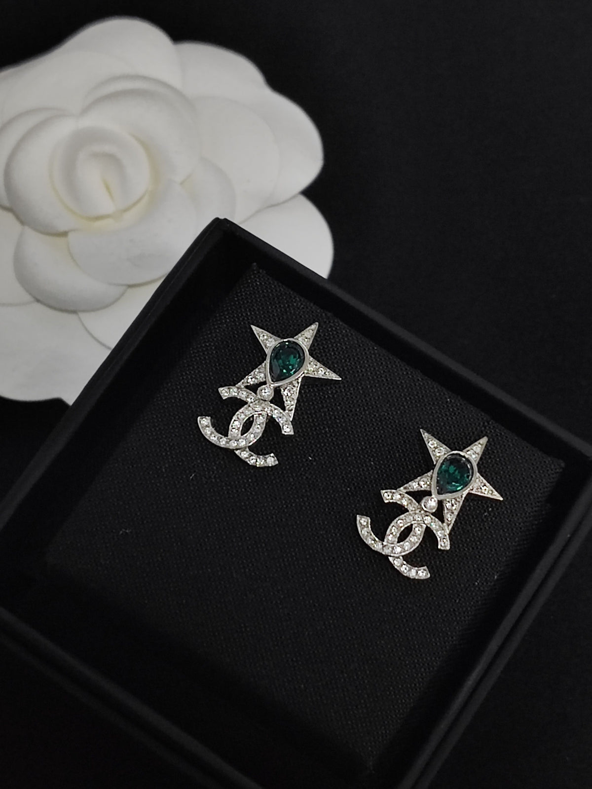Chanel - Other - Silver-tone metal with clear rhinestones and green stones; exact composition is not verified. - Green