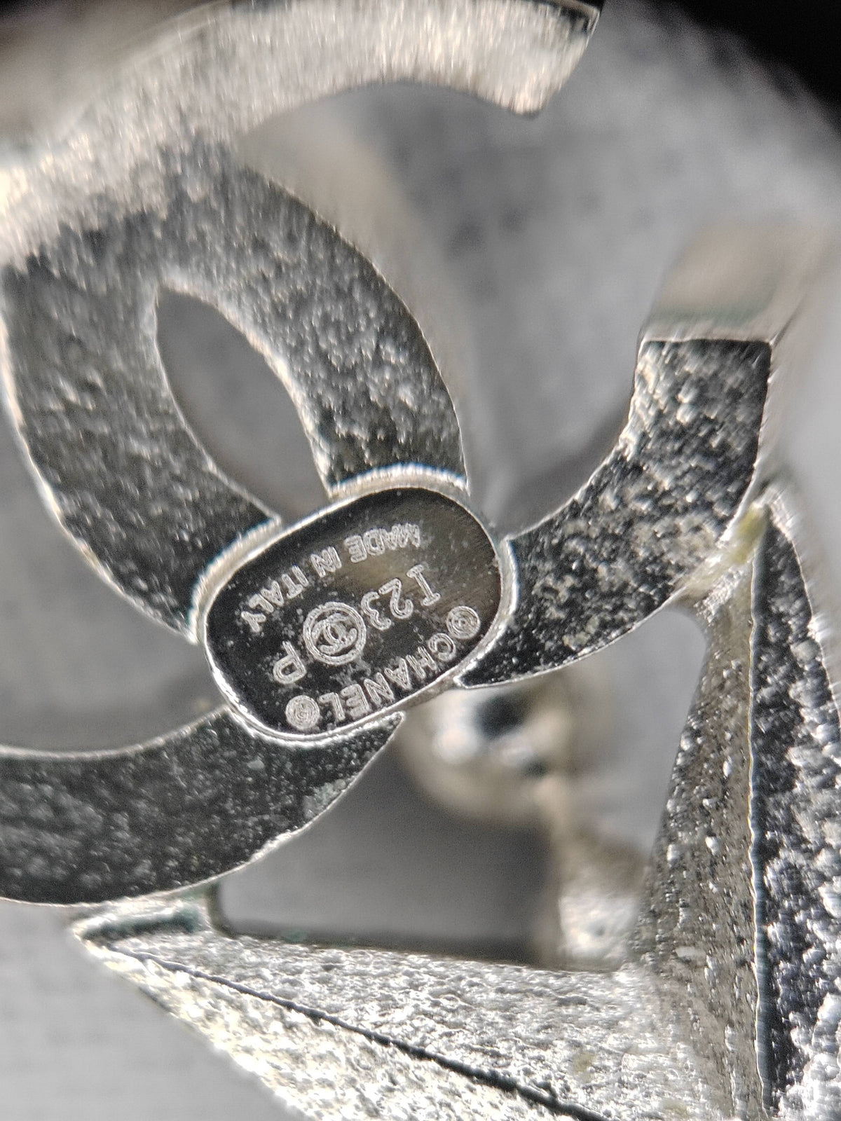 Chanel - Other - Silver-tone metal with clear rhinestones and green stones; exact composition is not verified. - Green