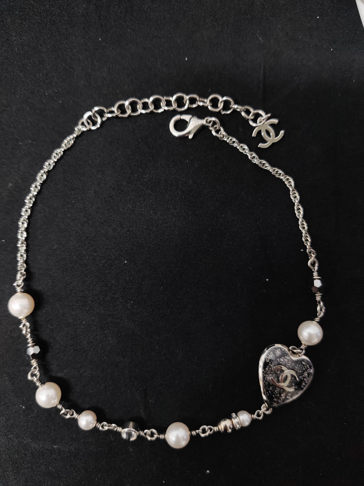 Chanel - Other - Silver-tone metal with faux pearl beads and crystal-like embellishments. - Multicolour