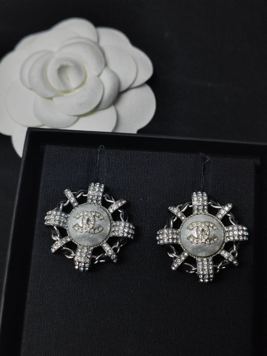 Chanel - Other - Silver-tone metal with rhinestone embellishment and a pearlescent-effect center. - Silver