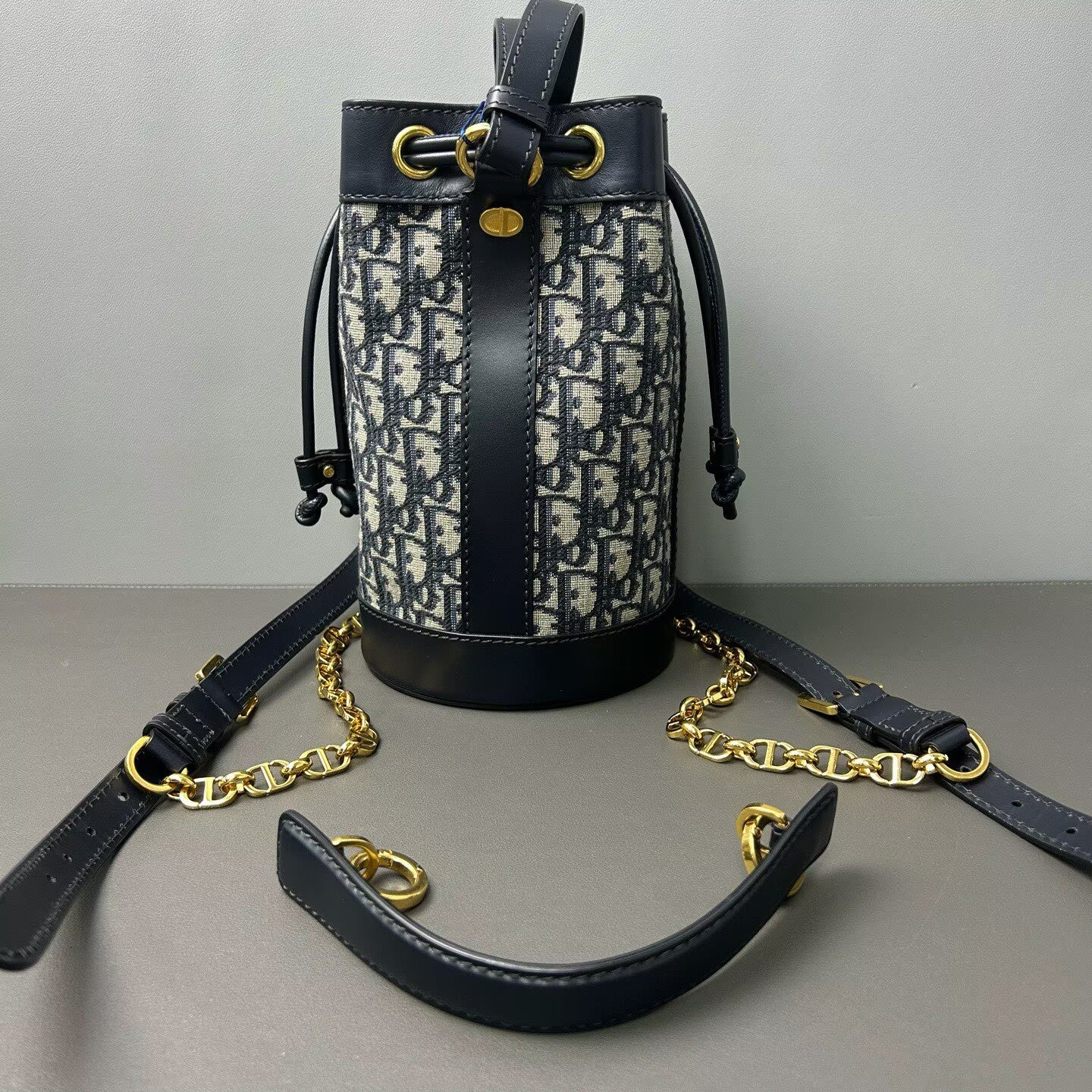 Dior - Oblique Drawstring Backpack - Dior Oblique canvas with calfskin leather trim - Multicolour (Navy and Black) - (small)