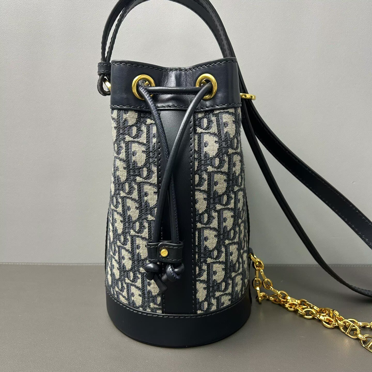 Dior - Oblique Drawstring Backpack - Dior Oblique canvas with calfskin leather trim - Multicolour (Navy and Black) - (small)