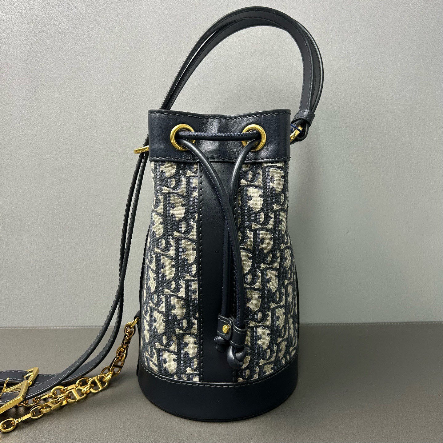 Dior - Oblique Drawstring Backpack - Dior Oblique canvas with calfskin leather trim - Multicolour (Navy and Black) - (small)