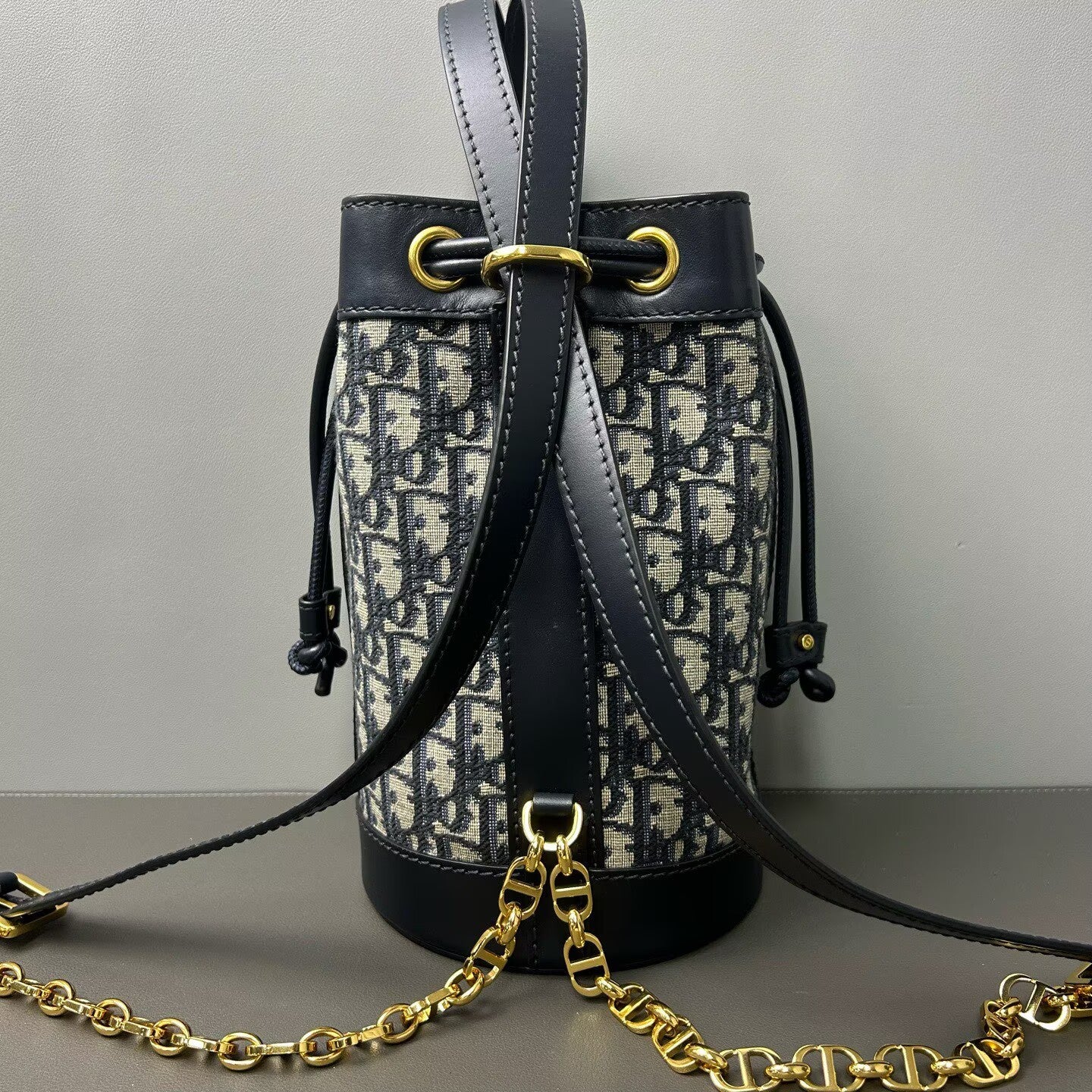 Dior - Oblique Drawstring Backpack - Dior Oblique canvas with calfskin leather trim - Multicolour (Navy and Black) - (small)