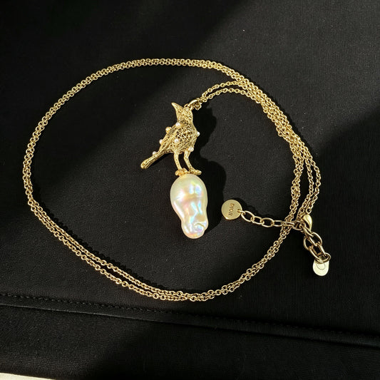 Dior - Other - Gold-tone metal with a pearl pendant and small pearl accents. - Gold