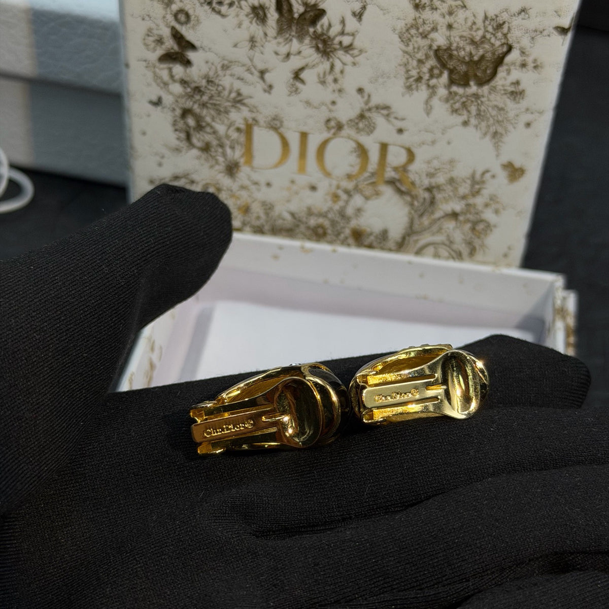 Dior - Other - Gold-tone metal with black enamel and clear rhinestone embellishments. - Black