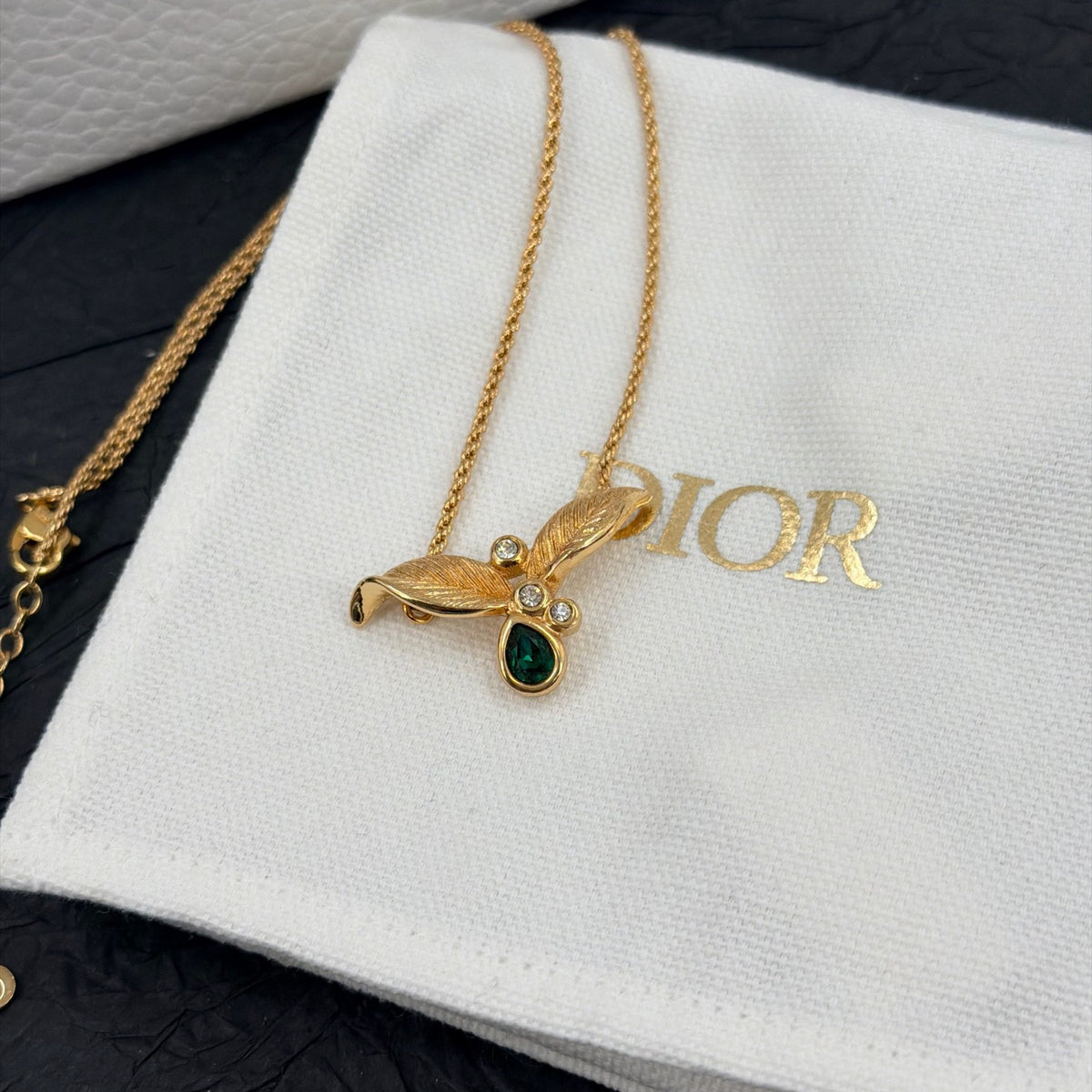 Dior - Other - Gold-tone metal with green and clear rhinestone embellishments. - Green
