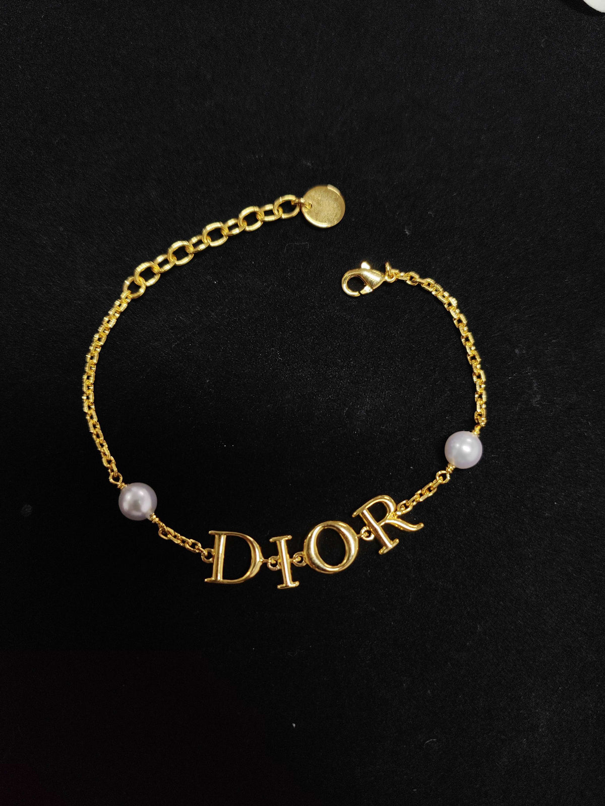 Dior - Other - Gold-tone metal with pearl-effect beads; bead composition unconfirmed. - Gold