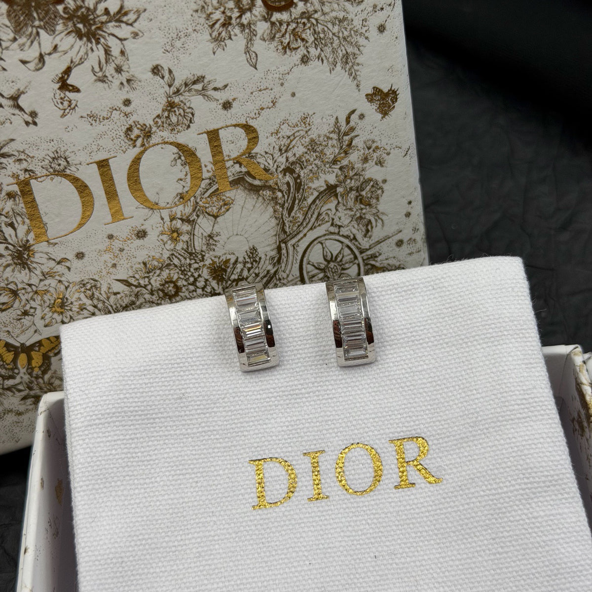 Dior - Other - Silver-tone metal with clear rhinestone embellishments; base metal composition unspecified. - Silver