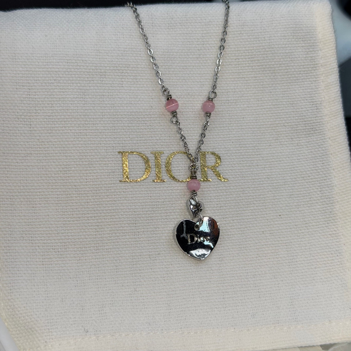 Dior - Other - Silver-tone metal with pink beads; bead material is unknown. - Multicolour