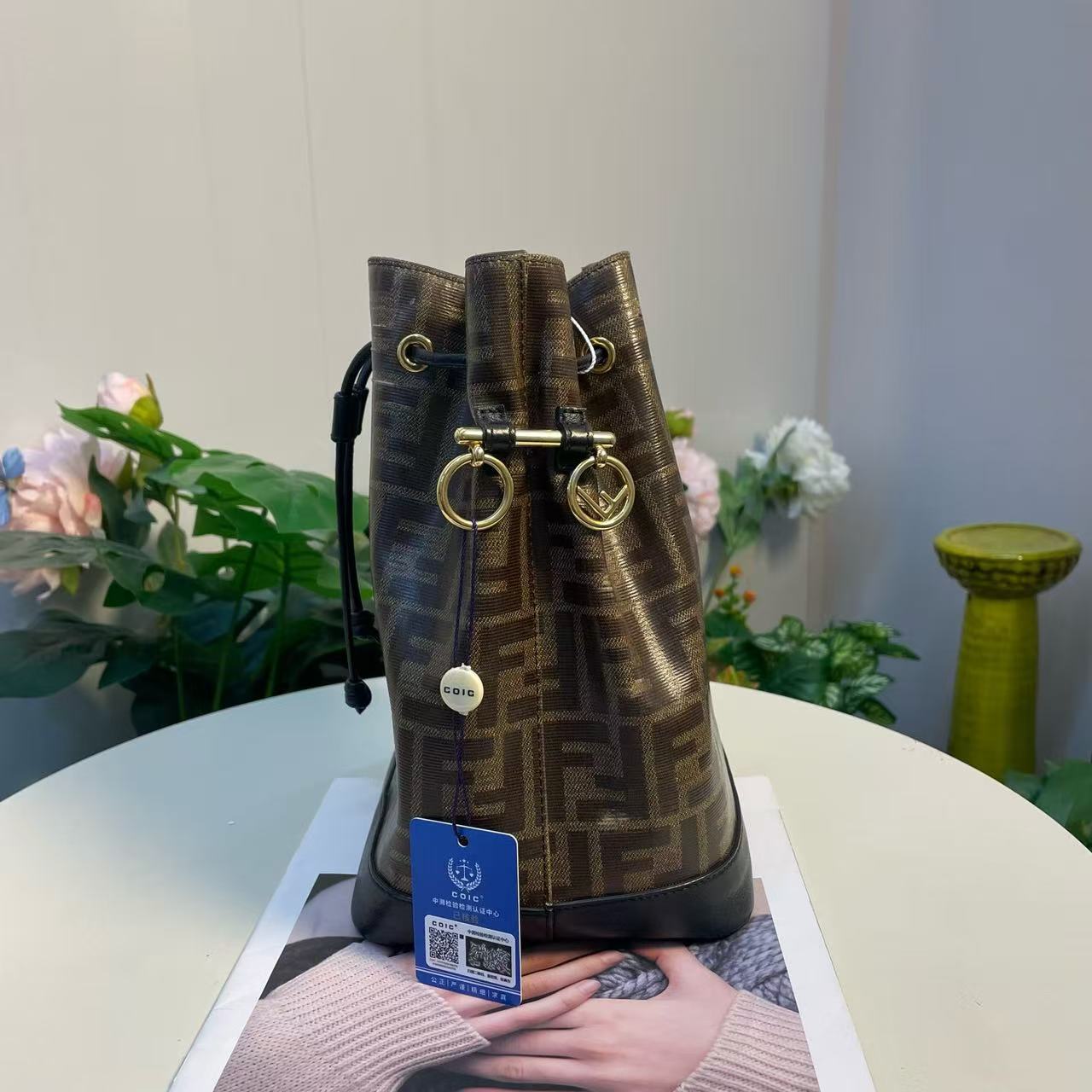Fendi - Mon Tresor Bucket Bag - Coated canvas with leather trim - Brown with black accents and gold-tone hardware - (small)