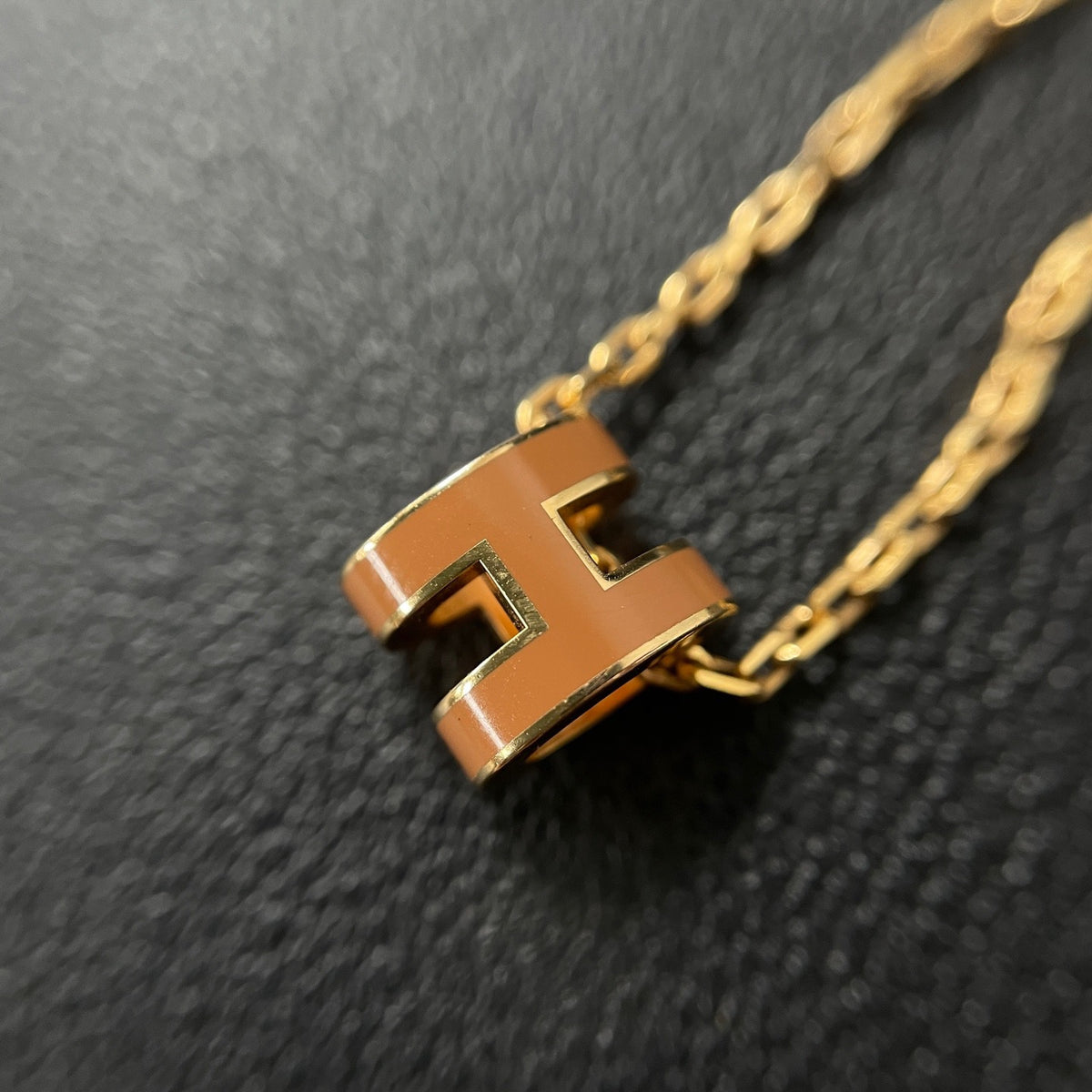 Hermes - Mini Pop H - Lacquered metal pendant with a rose-gold-tone metal chain; exact metal composition is not specified. - Orange