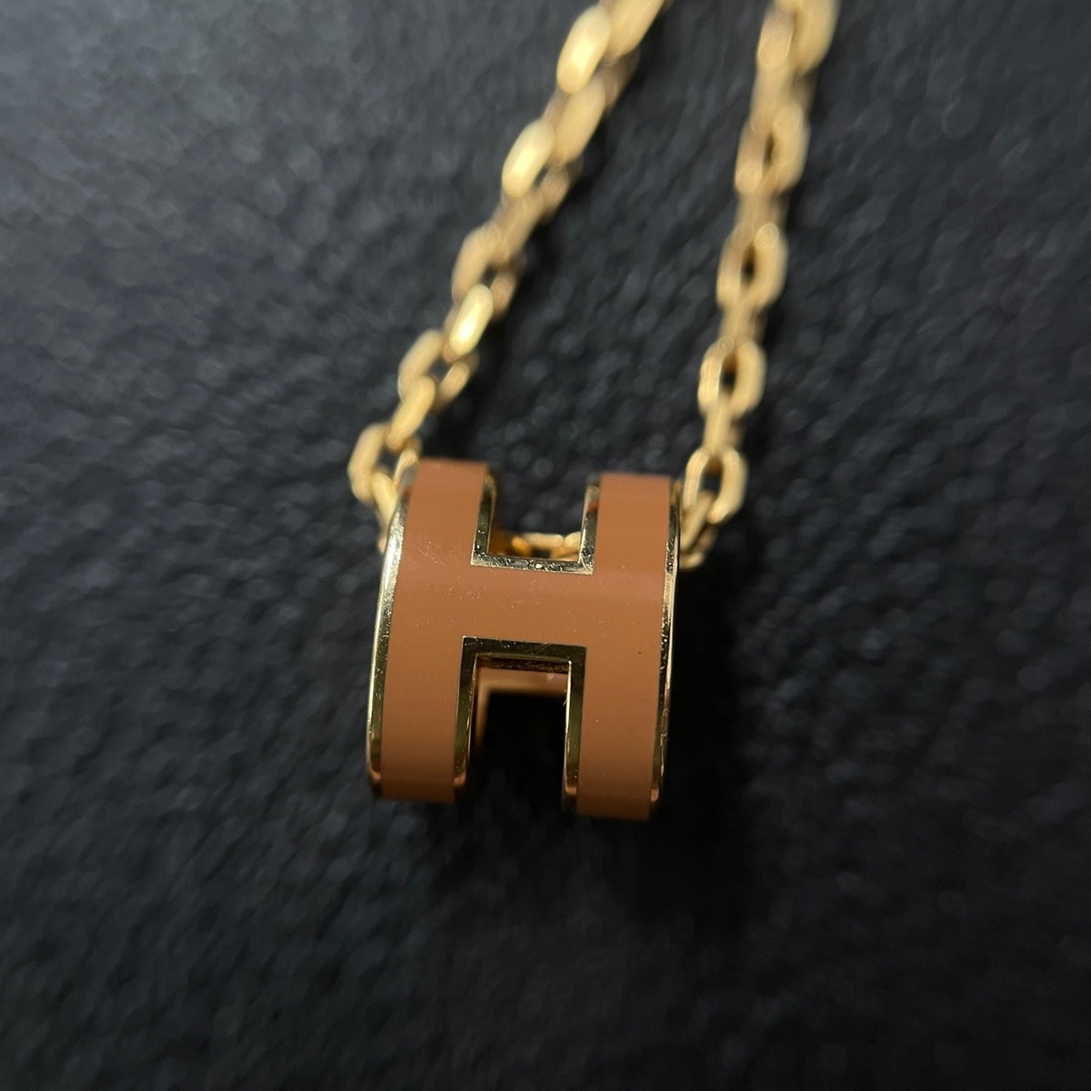 Hermes - Mini Pop H - Lacquered metal pendant with a rose-gold-tone metal chain; exact metal composition is not specified. - Orange